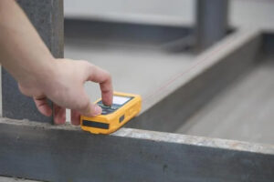 Laser distance meter in use